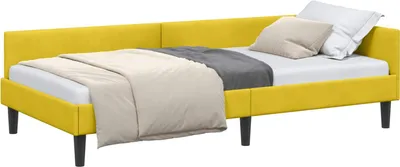 A yellow corner bed frame with bedding.