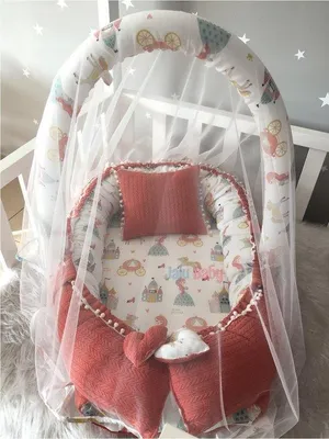 Image de Nid pour bébé Jaju avec oreiller et arche de jeu, 100 x 60 cm