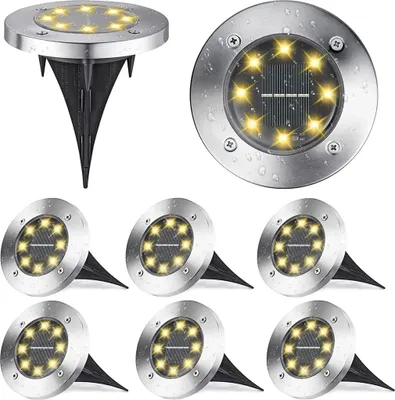 A collage of solar-powered ground lights, with one light shown separately and the rest arranged in a group.