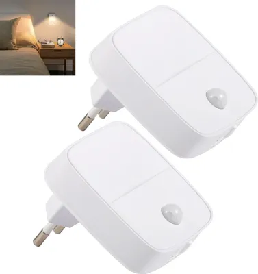 Two white LED night lights with motion sensors are shown against a white background. A smaller inset image shows one of the lights plugged into a wall socket next to a bed.