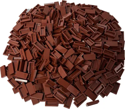 A pile of small, brown, rectangular building blocks.