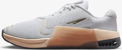 Immagine prodotto di Nike Metcon 9 Sneaker "White Metallic Gold" Bianco/Marrone, Taglia: 42