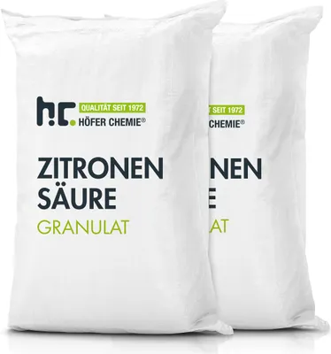 Two white bags of citric acid granules.