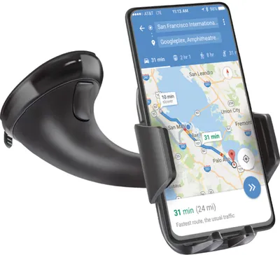 A smartphone displaying navigation directions is held in a black car mount with a suction cup base.