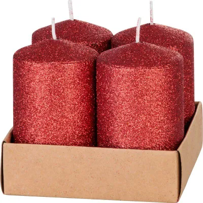 Four red glitter candles in a cardboard box.