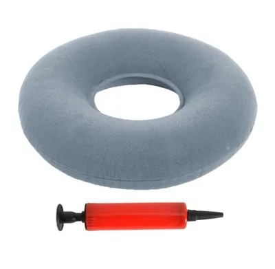 A gray inflatable ring cushion and a red hand pump are shown against a white background.