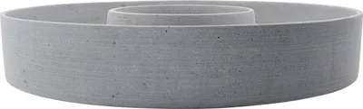 A grey concrete ring-shaped candle holder with a raised inner ring.