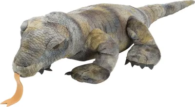 A plush toy of a Komodo dragon is shown against a white background.