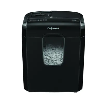 A black Fellowes paper shredder filled with shredded paper.