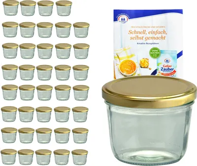 A set of glass jars with golden lids and a recipe booklet.