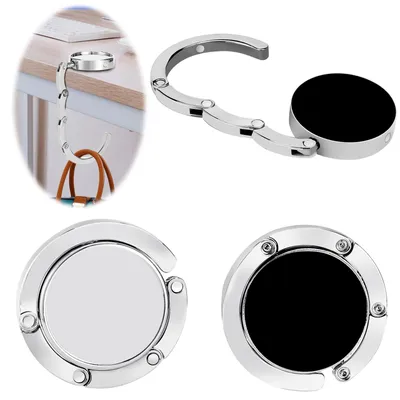 Image de 2 supports pliables antidérapants pour sacs à main, adaptés pour être fixés sur une table
