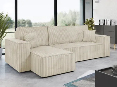 A cream-colored corduroy sectional sofa is shown in a modern living room setting.