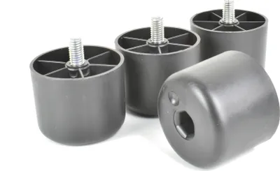 Four black plastic furniture feet with threaded bolts are arranged on a white background.