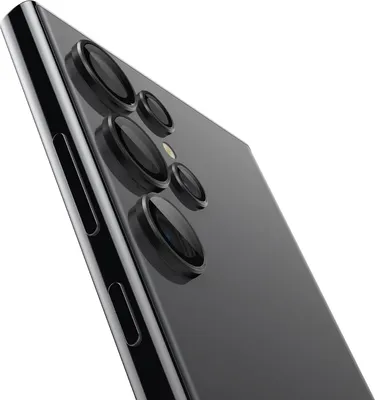 A close-up, angled view of the rear camera module of a black smartphone against a white background.