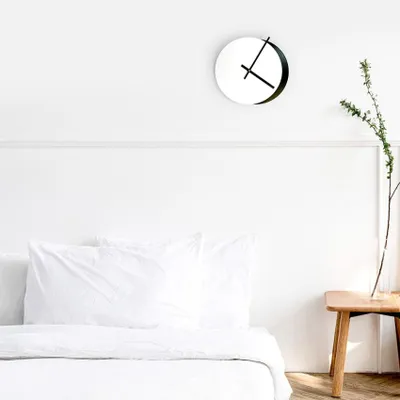 Immagine prodotto di Orologio da parete rotondo, moderno e minimalista, nei colori bianco e nero: Eclissi