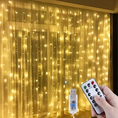 Imagen del producto de Cortina de luces LED - 3m x 3m, 300 luces LED, luz blanca cálida, ideal para ventanas, estilo "hadas" - 8 modos, control remoto, con conexión USB