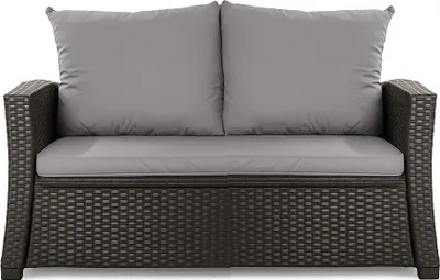 A front view of a dark gray rattan two-seater sofa with gray cushions.