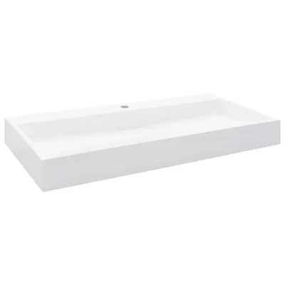 A white rectangular sink on a white background.
