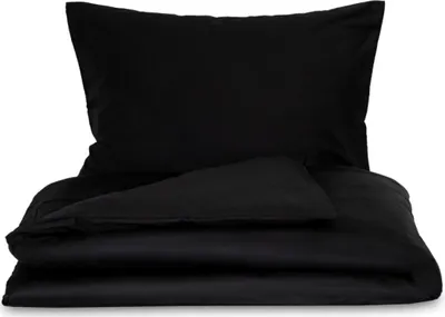 A black duvet cover and pillowcase are neatly folded and stacked on a white background.