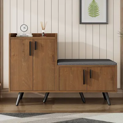 A shoe cabinet with a built-in bench is shown in a room with a wood-paneled wall.
