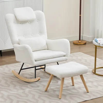 A white rocking chair and ottoman set in a room.