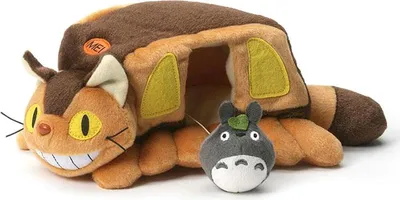 A plush toy of the Catbus from My Neighbor Totoro, with a small Totoro figure in front of it.
