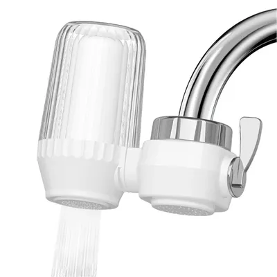 A close-up shot of a water filter attached to a faucet, with water flowing out.