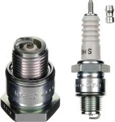 Two spark plugs are shown against a white background. One is disassembled, showing the internal components, and the other is fully assembled.