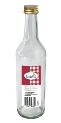 A clear studio shot of an empty glass bottle with a gold cap.