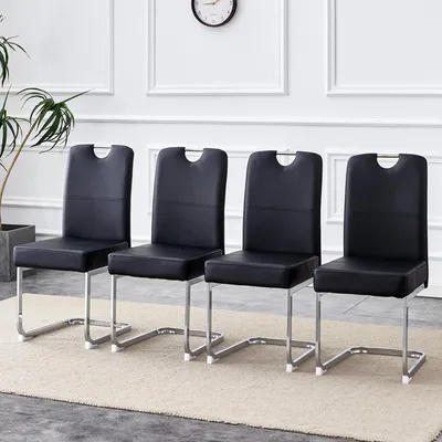 Immagine prodotto di Un set di due sedie da pranzo nere, con struttura robusta e imbottitura integrata, dal design ergonomico: un perfetto equilibrio tra comfort ed eleganza