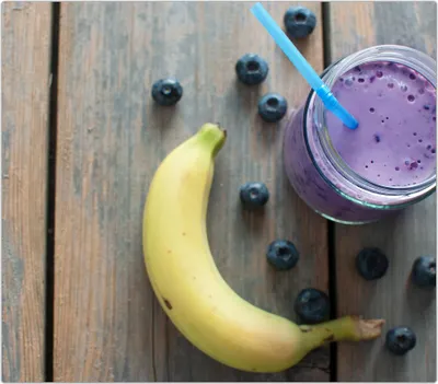 Produktbild von Spritzschutz Herdabdeckplatte Schneidebrett aus Glas Banane und Smoothie 1-Teilig (60x52cm)