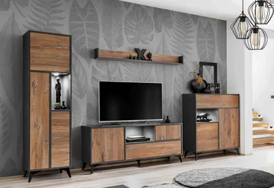 A modern living room set with a TV stand, a tall display cabinet, and a chest of drawers against a leaf-patterned wallpaper.