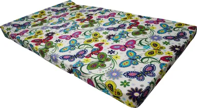 A mattress with a butterfly and floral pattern.