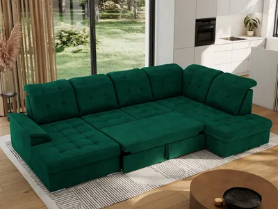 A dark green sectional sofa is shown in a modern living room setting with large windows overlooking a garden.