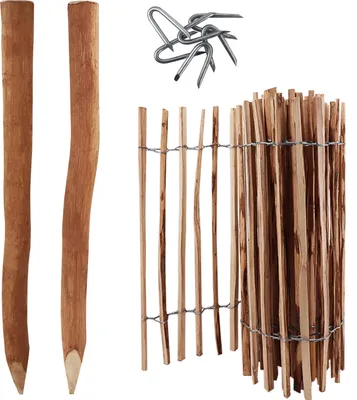 A collection of wooden fence posts, fence panels, and metal staples.