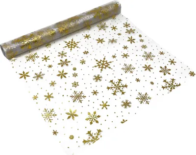 A roll of table runner with gold snowflake pattern on a white background.