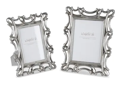Two ornate silver picture frames are displayed against a white background.