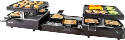 schwarzer Elektrogrill mit zwei Heizbereichen, darunter befinden sich kleine Pfännchen, auf denen ve
