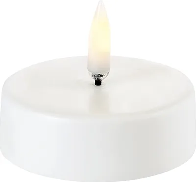 A white LED tealight candle with a flickering yellow flame.