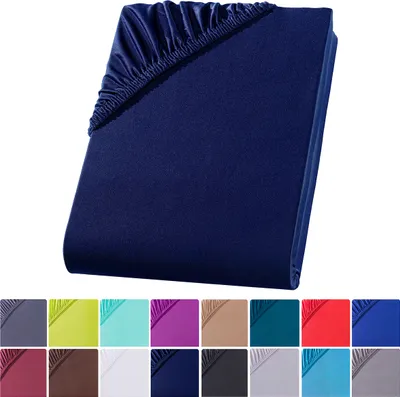 A folded dark blue fitted sheet is shown against a white background. Below the sheet are swatches of various colors, likely representing other available colors for the product.