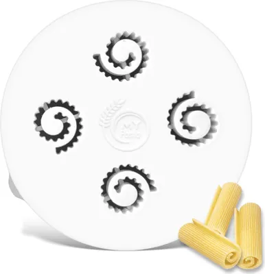 A white pasta extruder disc with four spiral-shaped openings and a logo in the center. A few pieces of rigatoni pasta are shown in the foreground.