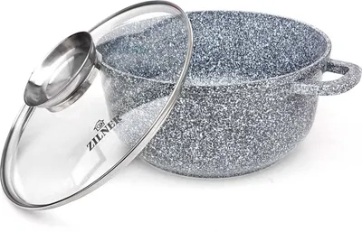 A speckled gray pot with a clear glass lid rests on a white surface.