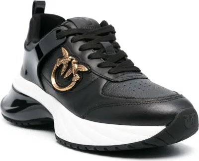 A studio shot of a black sneaker.