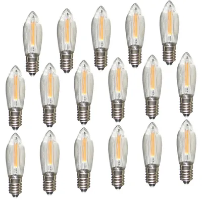 A collection of LED filament bulbs arranged in rows on a white background.