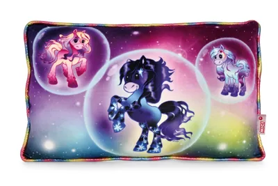 A rectangular pillow with a colorful space-themed design featuring three cartoon ponies inside bubbles against a starry background.