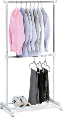 A double-tiered clothing rack with various garments and shoes displayed.