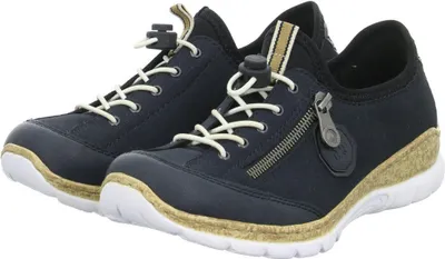 A pair of navy blue Rieker women's sneakers with white laces and a tan wedge sole.