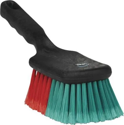 A black-handled brush with red and teal bristles is shown against a white background.