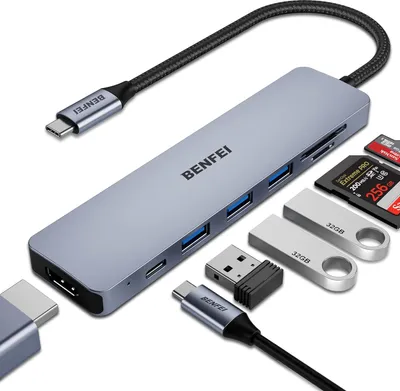 A USB-C hub and various accessories are displayed on a white background.