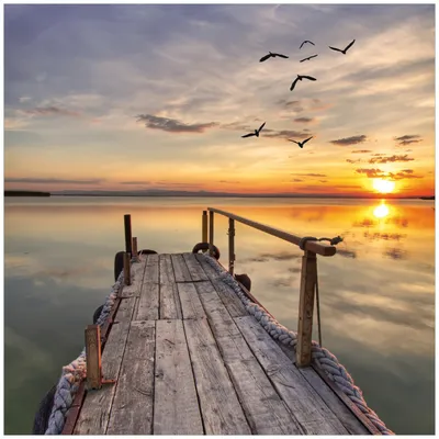 Produktbild von Wallario Sticker / Aufkleber für Kühlschrank / Geschirrspüler / Küchenschränke, selbstklebende Folie - 60 x 60 cm, Motiv: Sonnenuntergang über dem See  idyllischer Steg